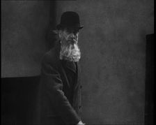 A Man Sporting a Beaver Beard Walking Along a Street, 1922. Creator: British Pathe Ltd