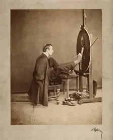 A man painting an oval portrait using his feet, c1870. Creator: Joseph Dupont