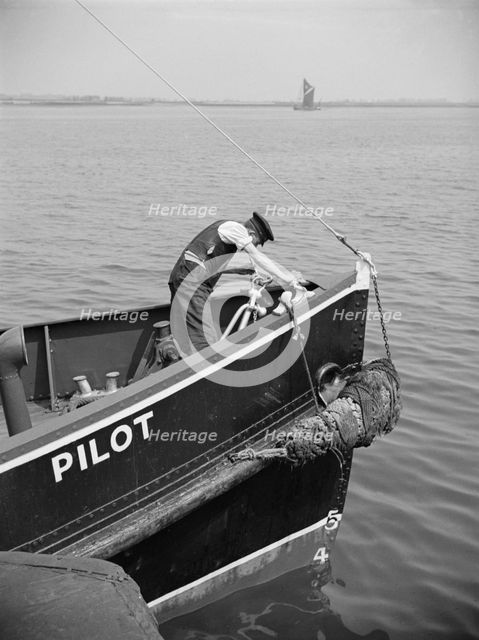 A man working on the bow of a River Thames pilot boat, c1945-c1965. Artist: SW Rawlings