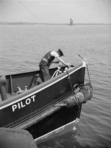 A man working on the bow of a River Thames pilot boat, c1945-c1965. Artist: SW Rawlings