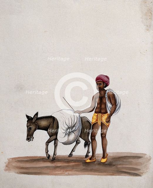 A man walking along with a donkey carrying a heavy load, (between 1800 and 1899?). Creator: Unknown.