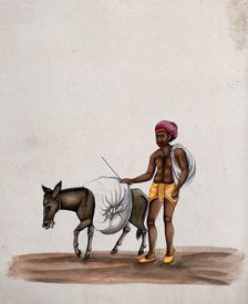 A man walking along with a donkey carrying a heavy load, (between 1800 and 1899?). Creator: Unknown