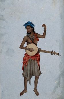 A man wearing a cloth skirt and a turban, playing a musical instrument. Creator: Unknown