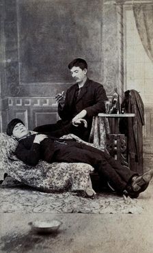 A man taking the pulse of another man, between 1800 and 1899. Creator: Unknown