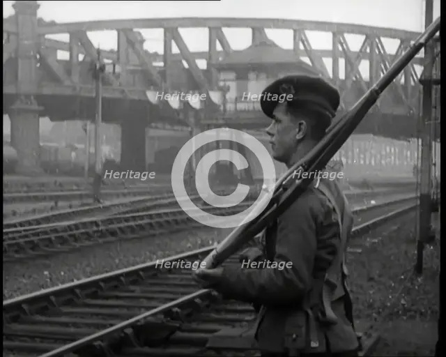 A Male Armed Soldier Guarding Railway Lines, 1926. Creator: British Pathe Ltd.