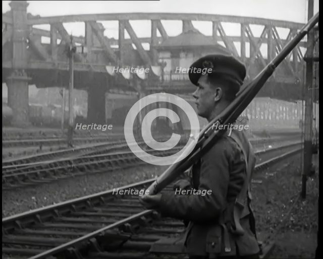 A Male Armed Soldier Guarding Railway Lines, 1926. Creator: British Pathe Ltd.