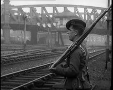 A Male Armed Soldier Guarding Railway Lines, 1926. Creator: British Pathe Ltd