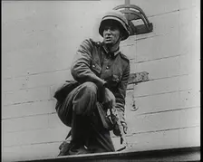 A Male German Army Soldier Holding a Polish Eagle Emblem Removed from the Wall of a Warsaw..., 1939. Creator: British Pathe Ltd