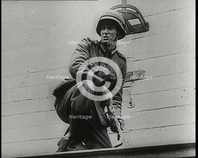 A Male German Army Soldier Holding a Polish Eagle Emblem Removed from the Wall of a Warsaw..., 1939. Creator: British Pathe Ltd.