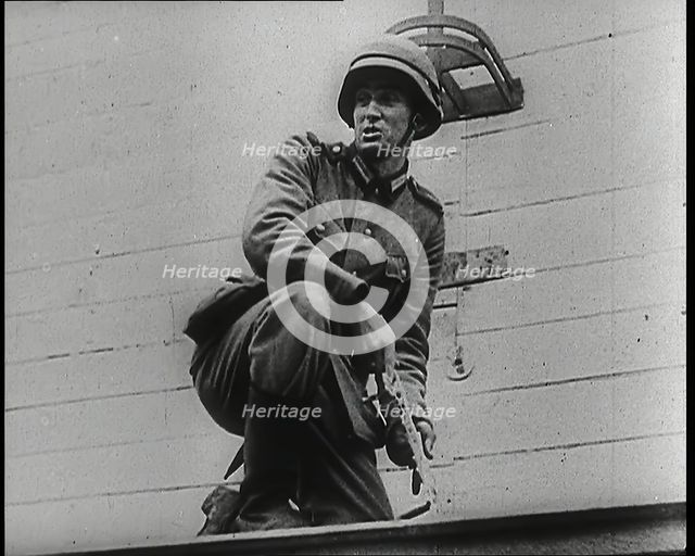 A Male German Army Soldier Holding a Polish Eagle Emblem Removed from the Wall of a Warsaw..., 1939. Creator: British Pathe Ltd.