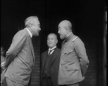 A Male Japanese Politician and a Male Military Leader Talking Together While Another Male..., 1937. Creator: British Pathe Ltd