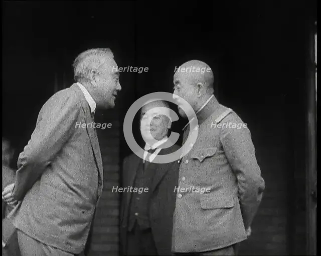 A Male Japanese Politician and a Male Military Leader Talking Together While Another Male..., 1937. Creator: British Pathe Ltd.