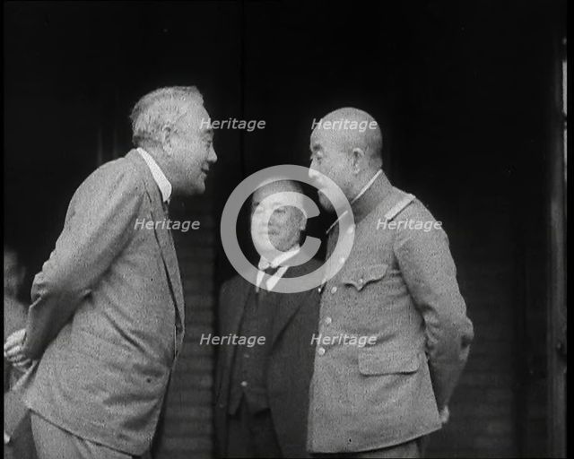 A Male Japanese Politician and a Male Military Leader Talking Together While Another Male..., 1937. Creator: British Pathe Ltd.