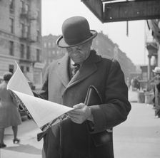 A Marcus Garveyite reading the OWI publication Negroes and the War, New York, 1943. Creator: Gordon Parks
