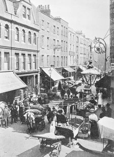 A market in Little Earl Street, looking east, East London. Creator: Unknown