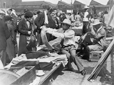 A market stall in Caledonian Market, Islington, London, 1930s. Creator: John H Stone