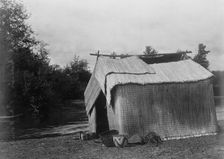 A mat house, Skokomish, c1913. Creator: Edward Sheriff Curtis