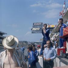A mechanic holding up a sign, French Grand Prix, Le Mans, France, 1967