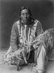 A medicine pipe-Piegan, c1910. Creator: Edward Sheriff Curtis