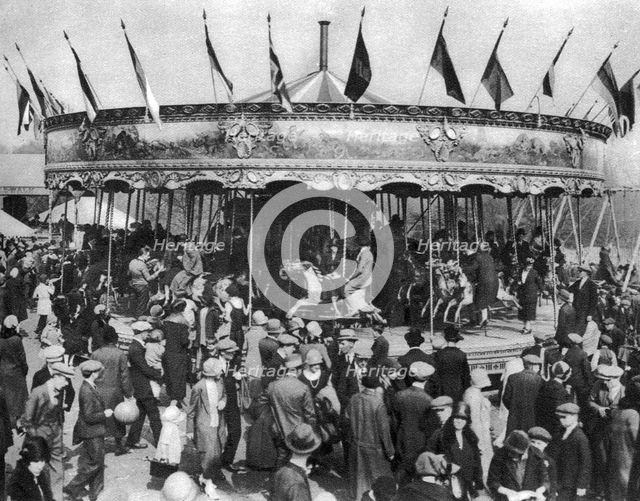 A merry-go-round, part of a bank holiday carnival on Hamstead Heath, London, 1926-1927. Artist: Unknown