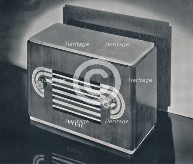 'A midget radio cabinet in wood veneer, with aluminum grill and dials', 1935. Artist: Dana Merrill.