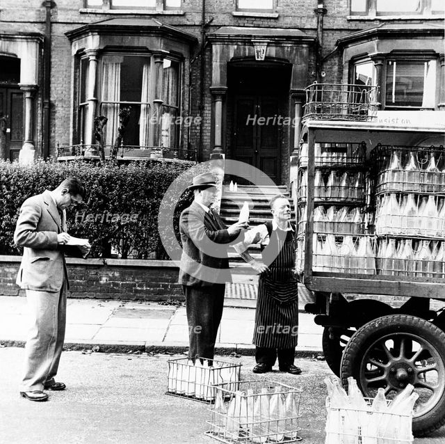A milkman on his rounds in London, c1950s. Creator: Henry Grant.