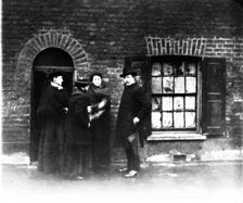 A missionary and three women, London, early 20th century. Artist: John Galt