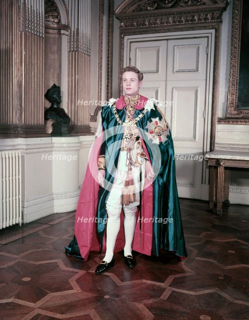 A model wearing the mantle and insignia of the Order of St Michael and St George, c1950s. Creator: Arthur Charles Kirby Ware.