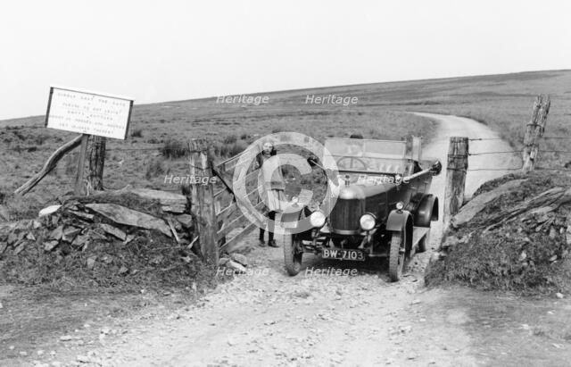 A Morris Bullnose driving through a gateway, early 1920s. Artist: Unknown