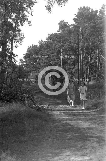 A mother and daughter walking in the forest, Skälderviken, Sweden, 1920s. Artist: Unknown