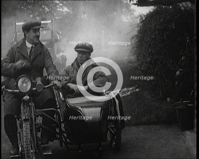 A Motorcycle and Sidecar Pulling up at a Petrol Station for a Refuelling, 1920. Creator: British Pathe Ltd.