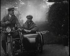 A Motorcycle and Sidecar Pulling up at a Petrol Station for a Refuelling, 1920. Creator: British Pathe Ltd