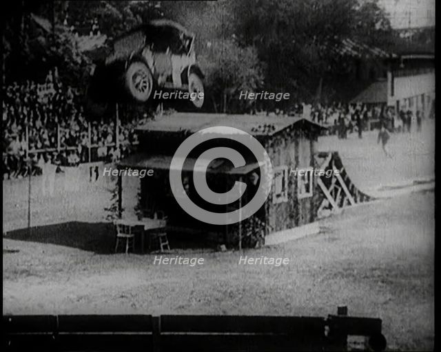 A Motorcar Jumping Over a Wooden Shack, 1920. Creator: British Pathe Ltd.