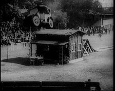 A Motorcar Jumping Over a Wooden Shack, 1920. Creator: British Pathe Ltd