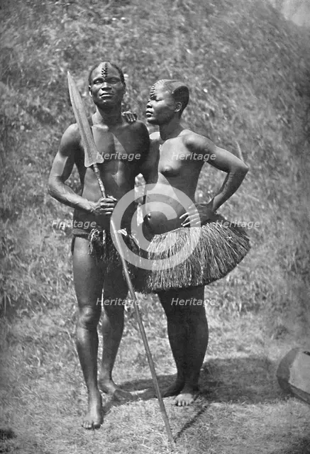 A Mulolo (Congo) warrior and his wife from the central Congo regions, 1902. Artist: Unknown.