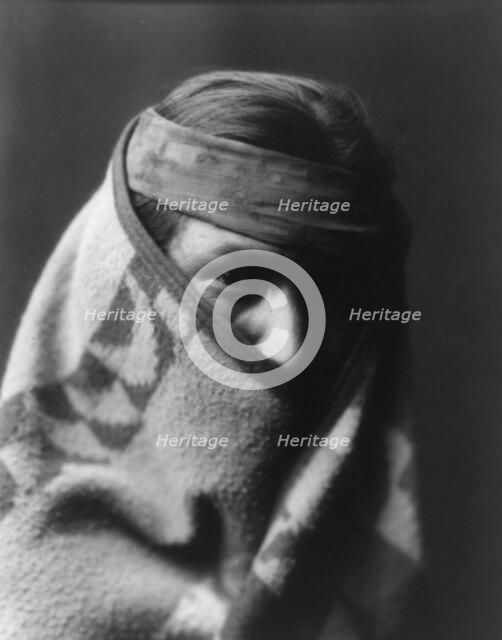 A Navaho [with blanket wrapped around head and shoulders], c1904. Creator: Edward Sheriff Curtis.
