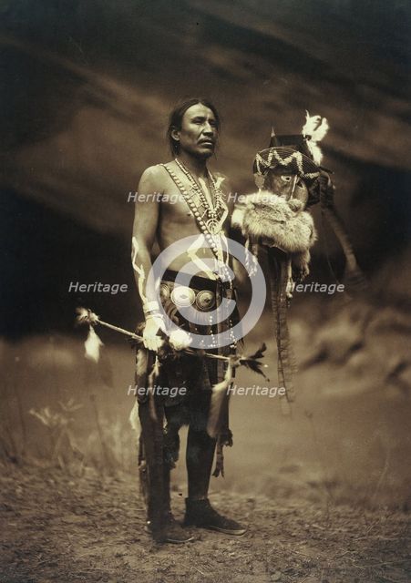 A Navajo man in ceremonial dress representing the Yebichai god Zahabolzi (Zahadolzha?), 1904. Creator: Edward Sheriff Curtis.