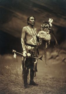 A Navajo man in ceremonial dress representing the Yebichai god Zahabolzi (Zahadolzha?), 1904. Creator: Edward Sheriff Curtis