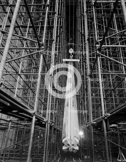 A nave column being hoisted into position during the construction of Coventry Cathedral, 1959.  Creator: John Laing plc.