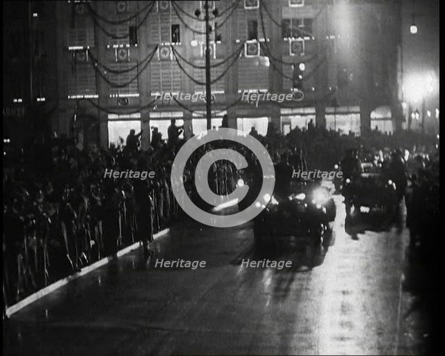 A Nazi Party Motorcade Driving Down a Berlin Street Lined With Crowds..., 1937. Creator: British Pathe Ltd.