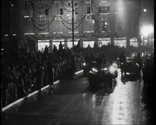 A Nazi Party Motorcade Driving Down a Berlin Street Lined With Crowds..., 1937. Creator: British Pathe Ltd