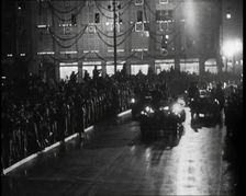 A Nazi Party Motorcade Driving Down a Berlin Street Lined With Crowds..., 1937. Creator: British Pathe Ltd