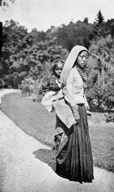 A Nepalese woman with her child, c1910