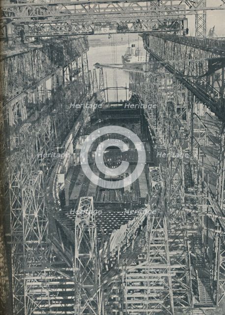 'A Nest of Steel. Cunard White Star liner Georgic in construction, 1927-1929, (1936). Artist: Unknown.
