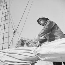 A New England fisherman preparing his boat to leave the New York docks, 1943. Creator: Gordon Parks