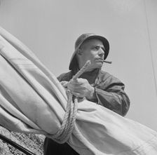 A New England fisherman preparing his boat to leave the New York docks, , New York, 1943. Creator: Gordon Parks