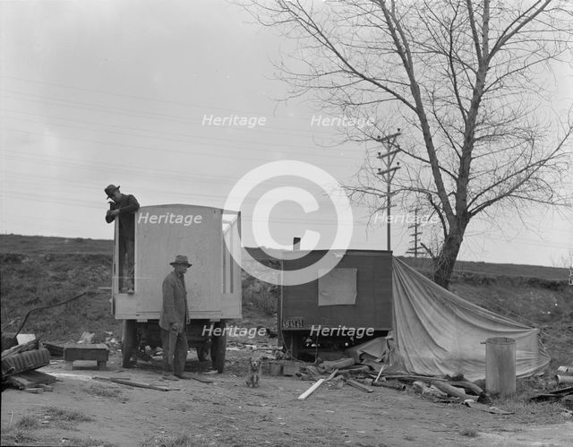 A new home on wheels (father and son), Yuba County, California, 1935. Creator: Dorothea Lange.