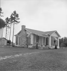 A new very fancy log bungalow..., near Gordonton, North Carolina, 1939. Creator: Dorothea Lange