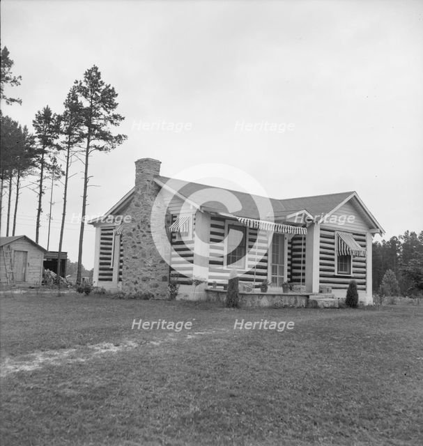 A new very fancy log bungalow..., near Gordonton, North Carolina, 1939. Creator: Dorothea Lange.