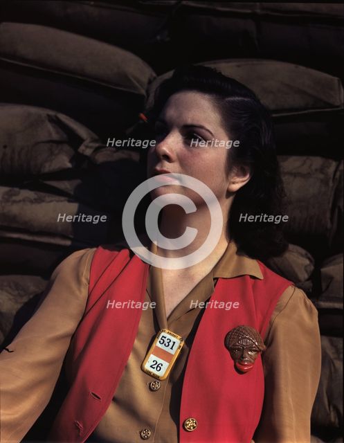 A noontime rest for a full-fledged assembly worker...Long Beach, Calif. Plant of Douglas..., 1942. Creator: Alfred T Palmer.